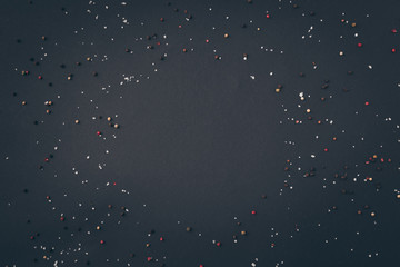 top view of scattered pepper on gray surface