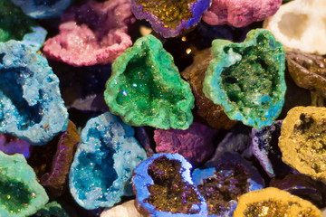 Fototapeta premium Colourful geodes cut open. Vibrant geological structures showing crystalline minerals within