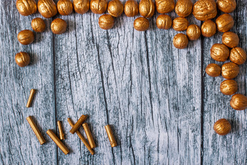 Gold nuts and gilt sticks on the background of old wooden panels, Christmas and New year background