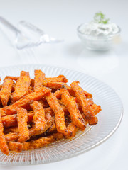 Homemade organic pumpkin with sour cream sauce. Traditional autumn dishes from pumpkin. Fried baked on grill pumpkin with spices and olive oil.