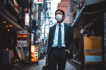 Senior business man moments on the streets of Tokyo