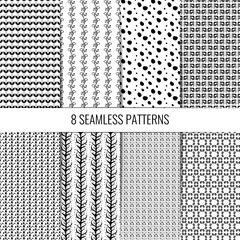 Pretty set of eight different seamless patterns in monochrome colors. Hand drawn lines and leaves.