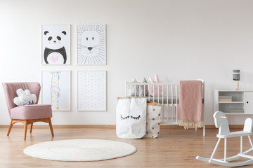 Fototapeta premium Pink armchair in child's room