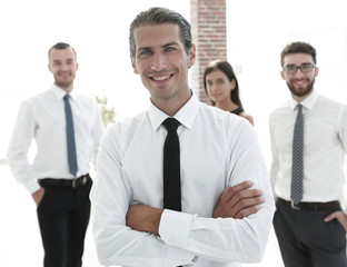portrait of a successful business person on the background of colleagues.