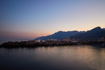 Naklejka na ściany i meble Sunset overlooking the sea and mountains on the Amalfi coast, Italy