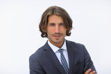 Happy young man with dark hair wearing an elegant suit