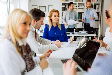 Businesspeople collaborating in office