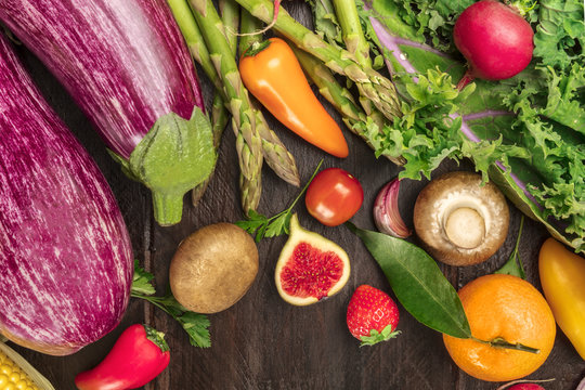 Overhead photo of vibrant fresh vegetables and fruit with copy space