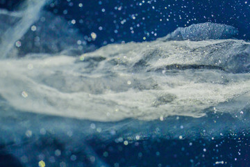 Naklejka premium Cracks in ice. Winter in Siberia, Baikal Lake.