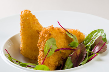 fried cheese with salad