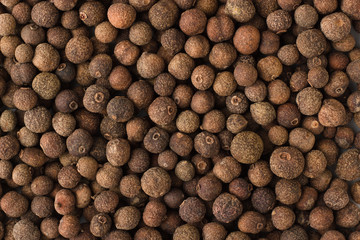 allspice spice as a background, natural seasoning texture - obrazy, fototapety, plakaty