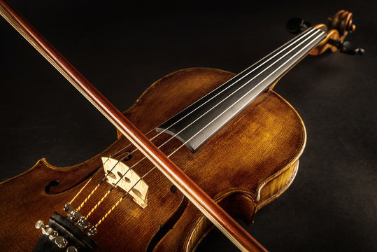 close up of a violin and bow