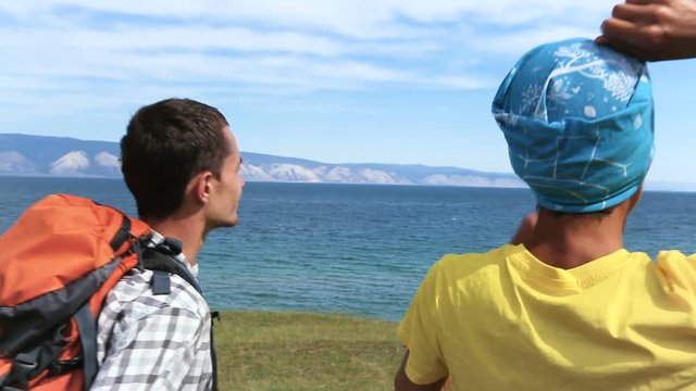 Hiking backpackers on hike in beautiful landscape in island Olkhon in Lake Baikal.