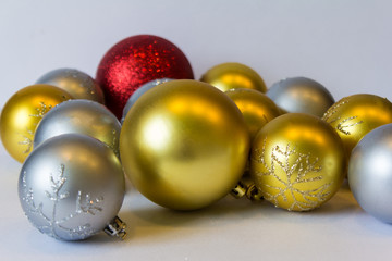 Naklejka na ściany i meble Christmas balls of different colors and sizes on white background