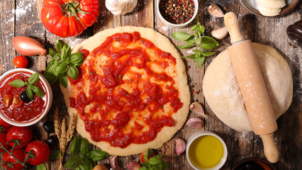 raw pizza dough and ingredient
