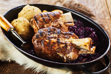 Traditional grilled pork hock with dumplings