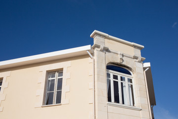 Detail of the top of a classic and old building in France