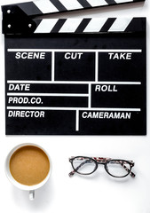 Screenwriter desktop with movie clapper board white background t