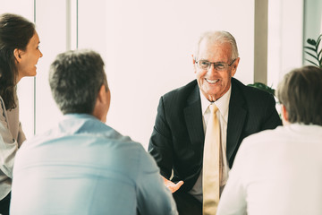 Business Leader Discussing Ideas With Colleagues