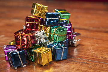 large number of small gifts on a wooden table
