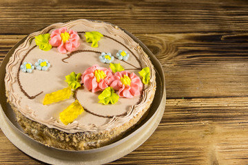 Cardboard box with Kiev cake with cream, nuts and meringue