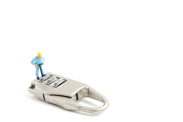 Miniature people worker  : Teamwork helps to unlock password on the keys. Team work concept.