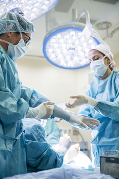 Medical staff dressing in in surgery