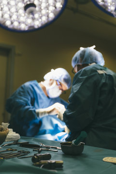 Group of surgeons working with patient