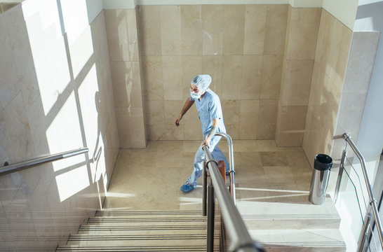 Man walking up stairs in hospital