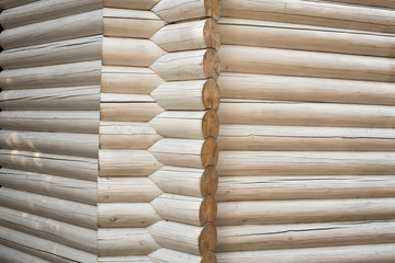 wall of logs painted white