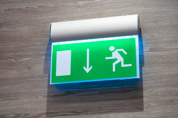pointer to exit on the wall