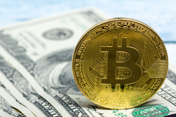 Bitcoin golden coin New virtual money and dollar background . Cryptocurrency. Business and Trading concept. Close-up shot