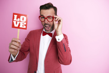 Screaming man trying valentine monocle