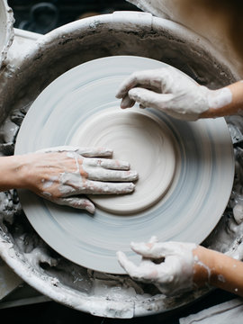 Two Women Making Pottery