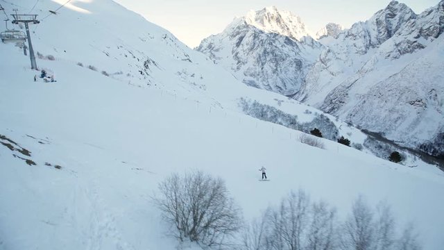 snowboarder in the mountains slides down