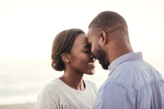 African couple enjoying a romantic moment at the beach
