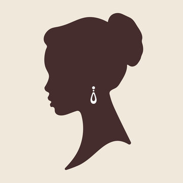 Silhouette of beautiful elegant african woman in profile isolated vector illustration. Beauty salon or jewelry product logo design