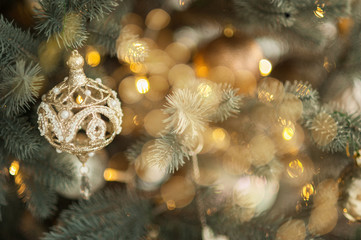 Obraz na płótnie Canvas Toy decoration on Christmas tree, closeup