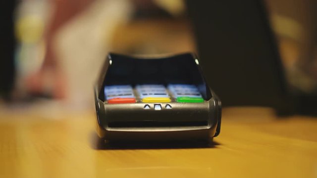 Man paying by credit card.