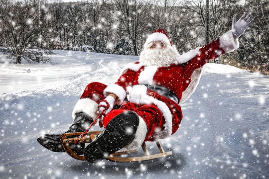 Santa Claus and winter road of snow 
