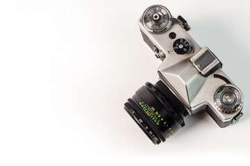 Retro film photo camera isolated on white background. Old analog