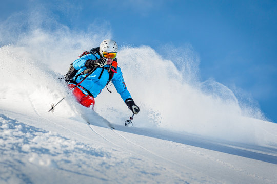 Male freeride skier in the mountains off-piste