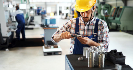 modern industrial machine operator working in factory