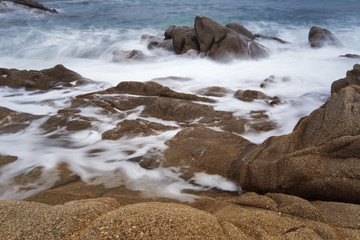 Sea with small waves long exposure, long exposure of sea and rocks