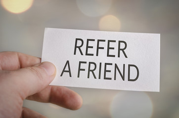 Reafer a friend card in hand