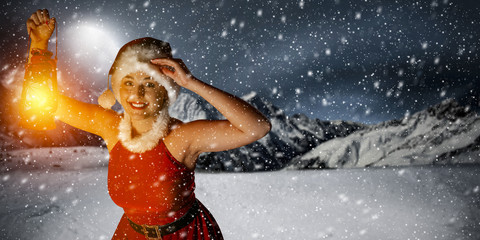 Fototapeta na wymiar woman with lamp and winter night 