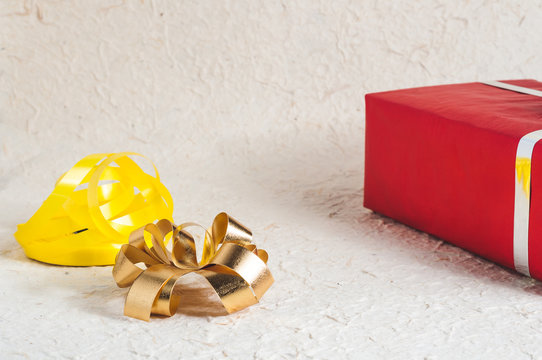 Red gift box with ribbon and bow