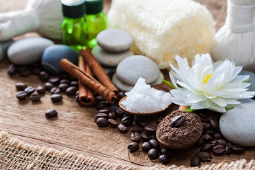 Fototapeta na wymiar Coffee powder and salt scrub, spa and massage objects, wellness and relaxation concept