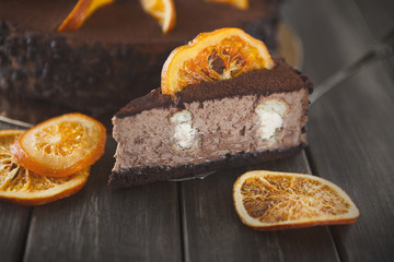 Chocolate cake with cream and profiterole