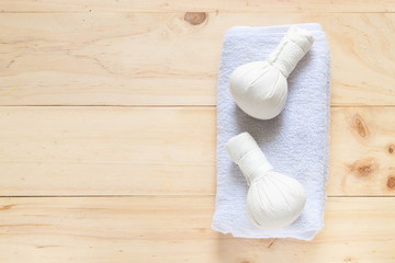 Towel on wooden texture and background, top view